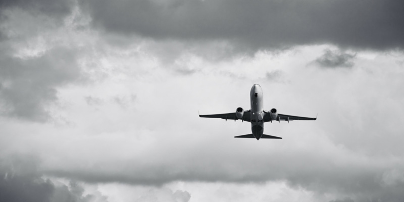 Airplane flying in the clouds.