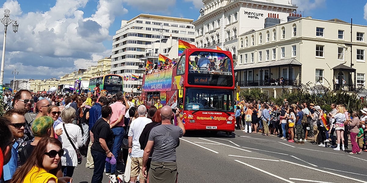 Crowd by the seaside at the Brighton Pride parade